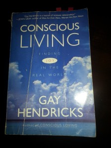 My copy of "Conscious Living," creased and worn from my immature tirade. 